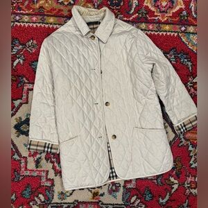 Authentic Burberry jacket size small in good condition. As is.